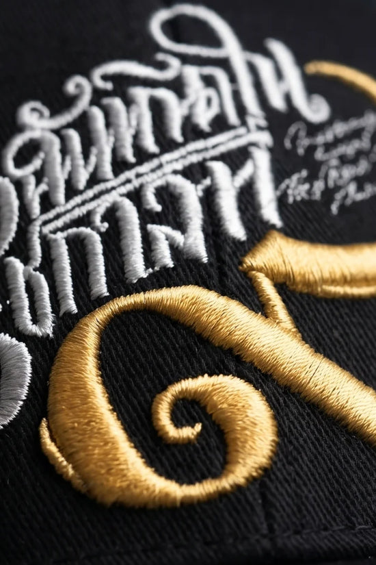 Black Script and Gold Emblem Baseball Cap
