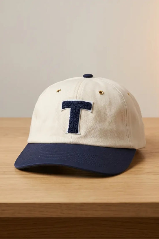 Bold "T" Varsity Baseball Cap — Cream / Navy