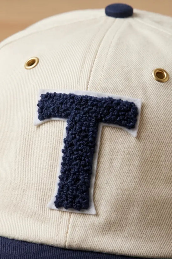 Bold "T" Varsity Baseball Cap — Cream / Navy