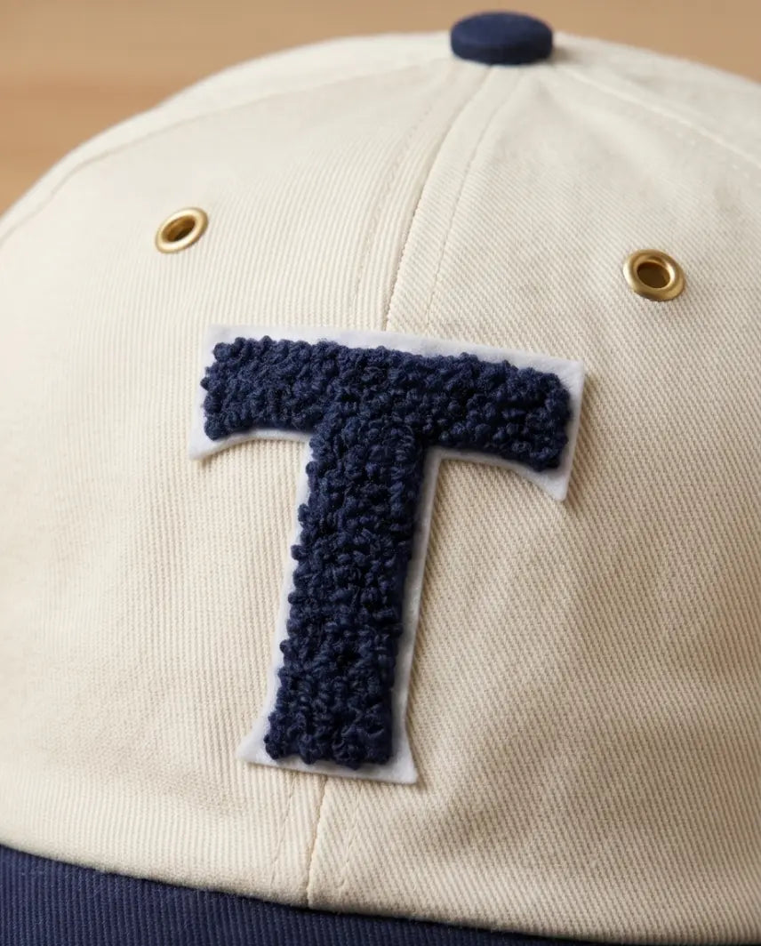 Bold "T" Varsity Baseball Cap — Cream / Navy